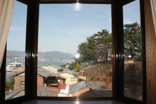 Quadruple Japanese-Style Room with Mountain View and Shared Bathroom