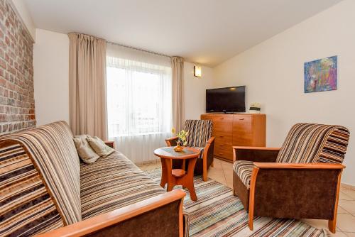 Спільний лаунж/ТБ зона, Kubu Apartment in Клайпеда