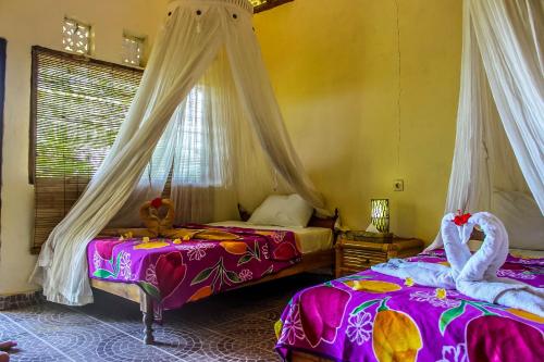 발리 Echo Alam Nusa Lodge 3성급 게스트하우스 스위트룸