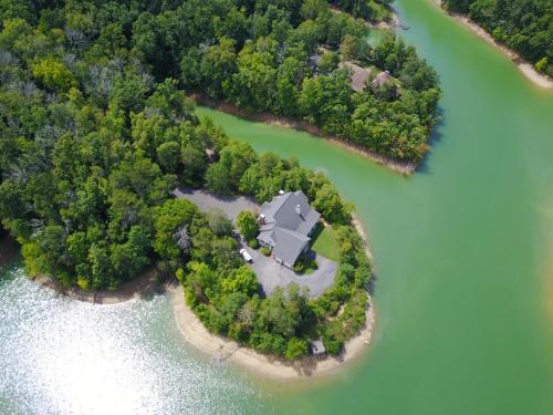 Smokie Mountain Lake House on Douglas Lake with 11 bedrooms, 6 bathrooms sleeping 30 - private, secluded, & lakefront on 5 acres of woodlands with Private Boat Dock, Theater Room, Games Room, Hot Tub, Indoor & Outdoor Kitchens