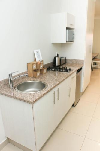 Kitchen, The Milkwood Beach Apartments in Isipingo