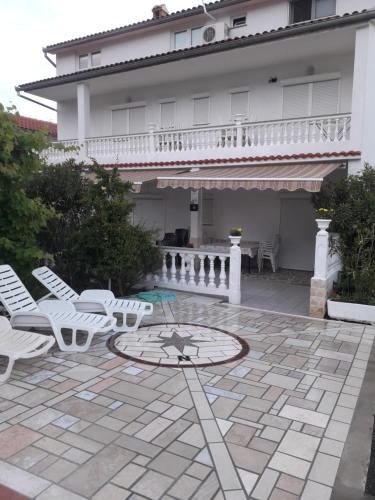 lovely apartments near the town of Rab with Children's pool, playground, garden, parking lot, grill, terraces,