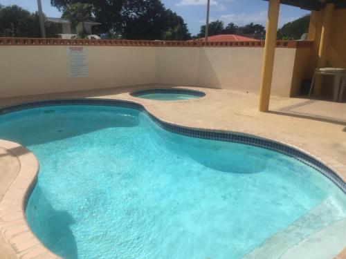 สระว่ายน้ำ, Comfortable Apartment in Boqueron - cash only in กาโบ โรโค