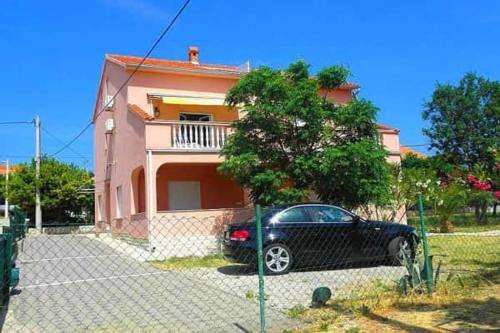 Apartments with a parking space Barbat Rab - 15459