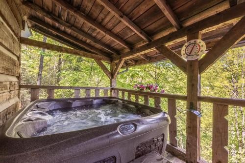 Authentic log home with hot tub, fireplace, fire pit and billiards ! thumb 4