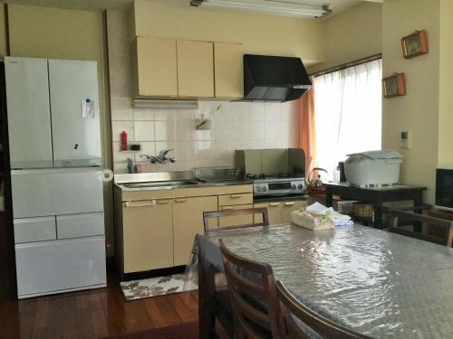 Küche, Pension Umi no soba in Ginoza