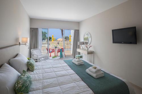 Leonardo Laura Beach & Splash Resort Set in a prime location of Paphos, Leonardo Laura Beach & Splash Resort puts everything the city has to offer just outside your doorstep. The property offers a high standard of service and amenities t