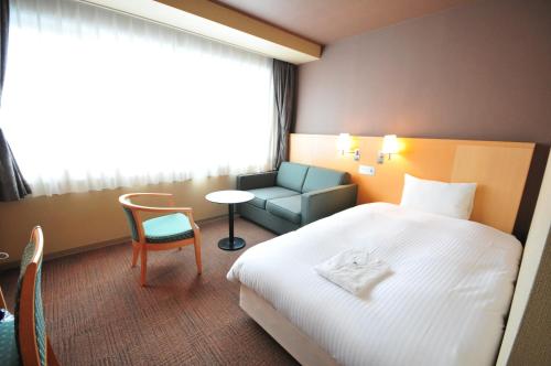 Hotel Premium Green Hills - Tap to explore photos