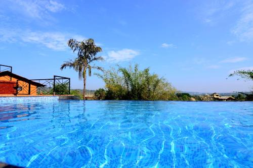 Swimming pool, Cozywoods Hill Resort in Old Goa