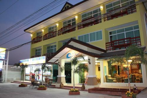 a large building with a large window in front of it, The Muk Lagoon hotel (SHA Extra Plus) in Mukdahan