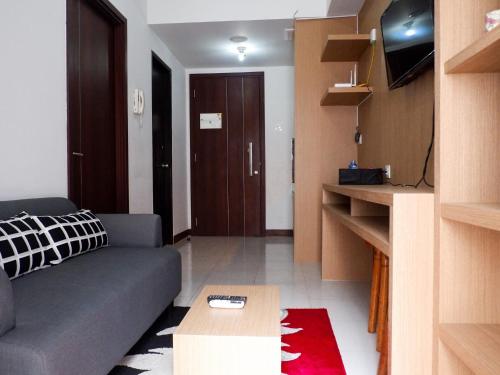 Cozy 1BR Scientia Residence Apartment near Summarecon Mall Gading Serpong By Travelio