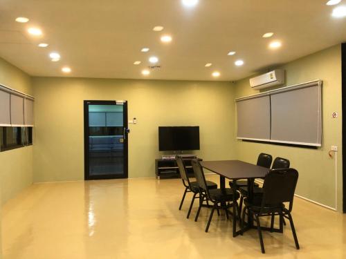 Shared lounge/TV area, Thyme Xeriscape Hostel in Kanchanaburi