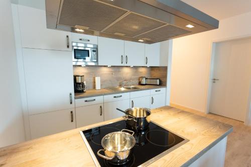 Kitchen, Komfort-Ferienwohnung Wellenbrecher by Meer-Ferienwohnungen in Olpenitz