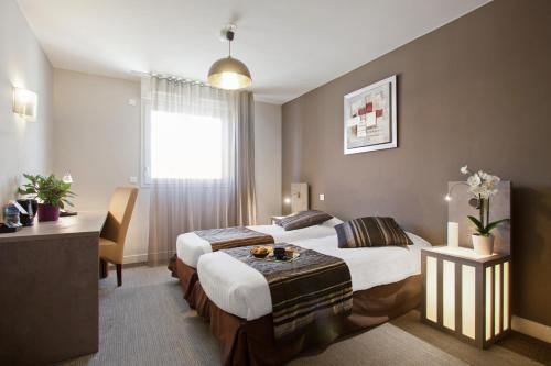 Фотография номера апарт отеля Appart'City Marseille Centre Prado Velodrome (ex Seven Urban Suites Marseille)
