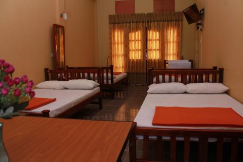 Quadruple Room with Balcony room in Anura Guest Inn