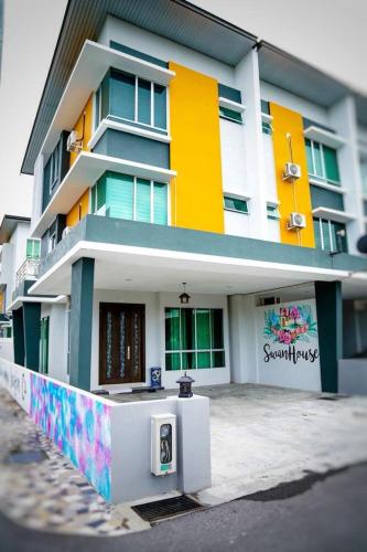 a building with a sign on the side of it, SIBU SWANHOUSE 2 (three storey townhouse) in Sibu