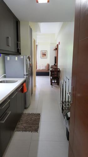 a kitchen with a stove, refrigerator, sink, and dishwasher, Pico De Loro - Myna B Studio in Nasugbu