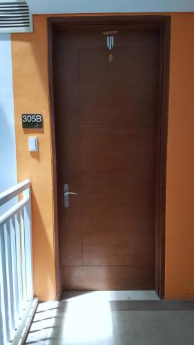 a door that is open to a hallway, Pico De Loro - Myna B Studio in Nasugbu
