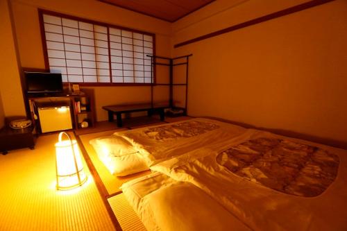 Hanazono Kaikan Stop at Hanazono Kaikan to discover the wonders of Kyoto. The property has everything you need for a comfortable stay. Daily housekeeping, wheelchair accessible, 24-hour front desk, facilities for dis