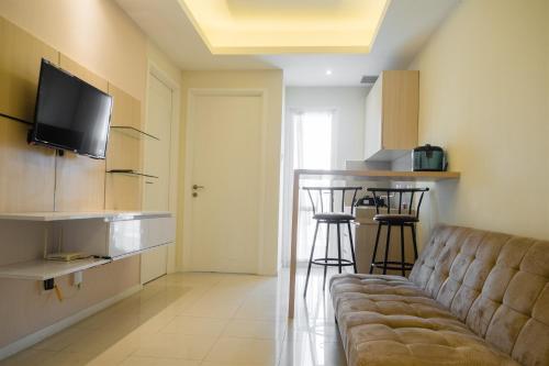 Compact 2BR with Sofa Bed at Parahyangan Residence By Travelio