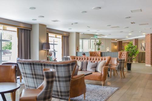 ห้องส่วนกลางสำหรับนั่งเล่น/ดูทีวี, Macdonald Morlich Hotel at Macdonald Aviemore Resort in อาเวียร์มอร์