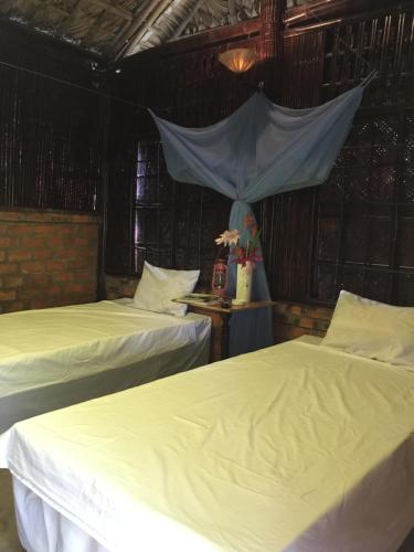 Tweepersoonskamer met 2 aparte bedden en Uitzicht op de Tuin (Twin Room with Garden View)