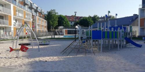Játszótér, Apartament Słoneczny (Apartament Sloneczny) in Podczele