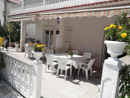 lovely apartments near the town of Rab with Children's pool, playground, garden, parking lot, grill, terraces,