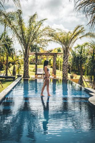 Ocho Bali Surf Camp - Tap to explore photos