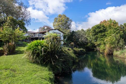 Classical Lockwood house nearby the stream Rotorua