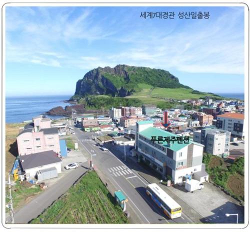 a city with a lot of houses on the side of the road, Pureun Jeju Pension in Jeju