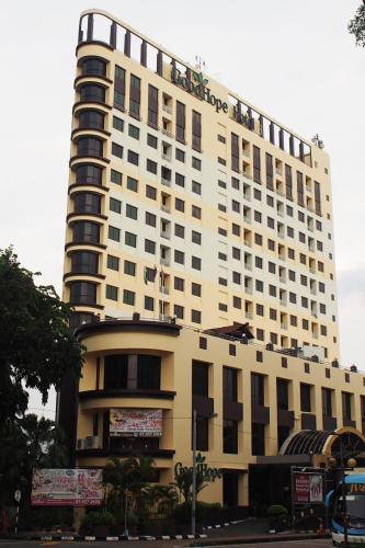 a tall building with a large clock on it's side, GoodHope Hotel Johor Bahru in Johor Bahru