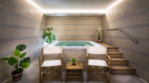 Karstais baseins, Wellness Hotel Holzberg - kryty relaxacni bazen, detsky bazen, whirlpool, sauna, restaurace, bowling in Suča Rudna