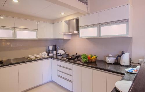 Kitchen, Oakwood Residence Naylor Road Pune near Osho International Meditation Resort and Guesthouse