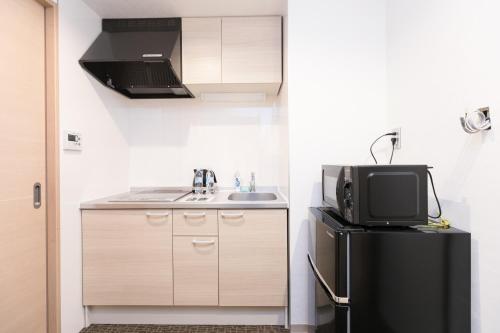 Kitchen, Stay SAKURA Kyoto Gyoen East in Kita