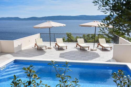 Seaside apartments with a swimming pool Marusici Omis - 10009 Mimice