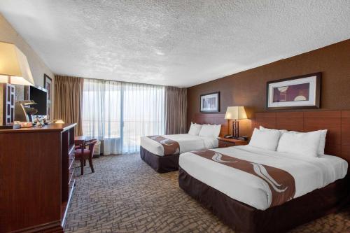 Standard Queen Room with Two Queen Beds with Balcony and Pool View - Non-Smoking