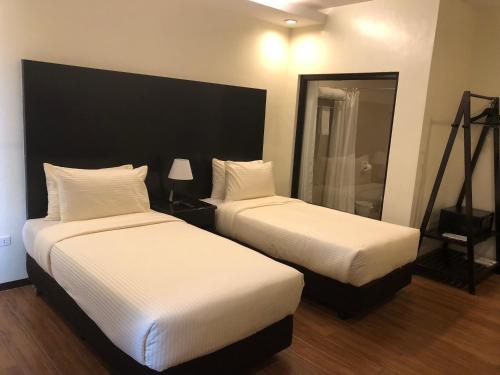 Pina Suites Set in a prime location of Ormoc, Pina Suites puts everything the city has to offer just outside your doorstep. Featuring a satisfying list of amenities, guests will find their stay at the property a 