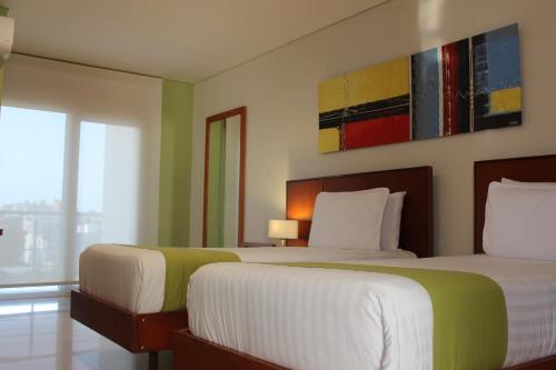 Hotel Atrium Plaza The 4-star Hotel Atrium Plaza offers comfort and convenience whether youre on business or holiday in Barranquilla. The property features a wide range of facilities to make your stay a pleasant experi