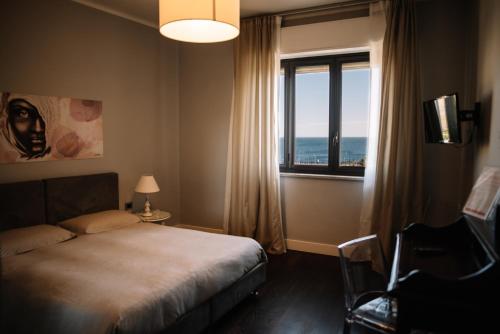 Quadruple Room with Sea View room in B&B Hotei