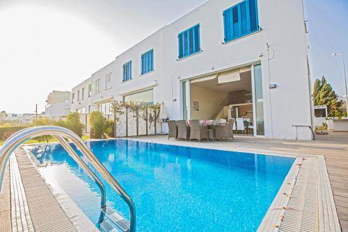 Picture Relaxing Beside Your Private Pool in Protaras Reading Your Favourite Book Protaras Villa 1271 - image 8