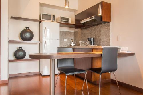 Nico Apartasuites Nico Apartasuites is perfectly located for both business and leisure guests in Bogota. The property offers a wide range of amenities and perks to ensure you have a great time. Service-minded staff wil