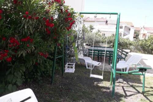 lovely apartments near the town of Rab with Children's pool, playground, garden, parking lot, grill, terraces,