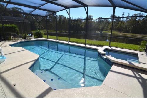 Sunny lake view villa with pool spa - close to attractions