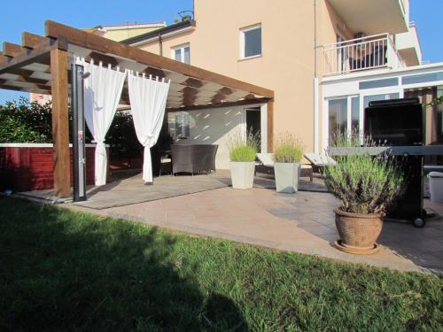 One-Bedroom Apartment with Patio and Sea View