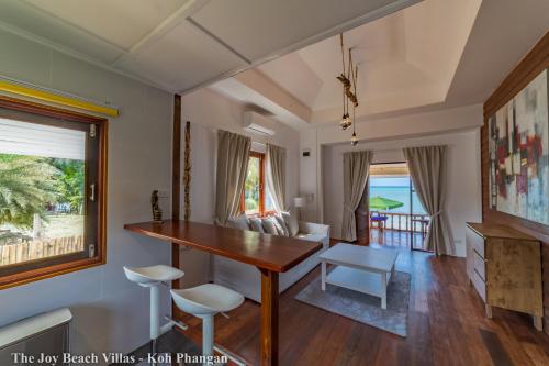 Joy Beach Villas - Tap to explore photos