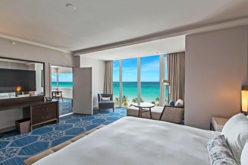 ONE BEDROOM SUITE 1 KING. Parlor with sitting area, pullout sofa bed, dining table