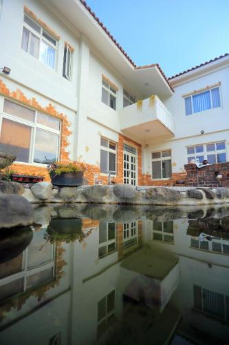 The house behind stream in Dahu Község