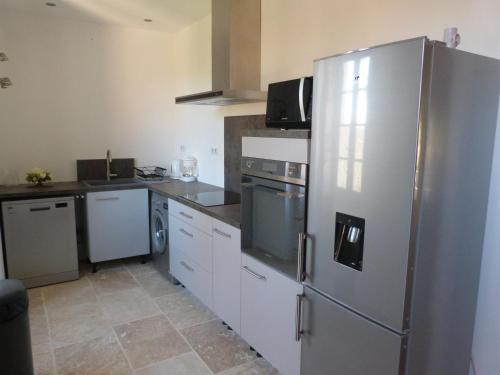 صالة مشتركة/ منطقة التلفزيون, Gîte avec Piscine proche de St Cirq Lapopie (Gite avec Piscine proche de St Cirq Lapopie) in بيرغانتي