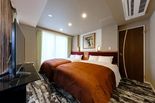 Suite(Two Double Beds) with Massage Chair and Balcony - Non-Smoking image 3